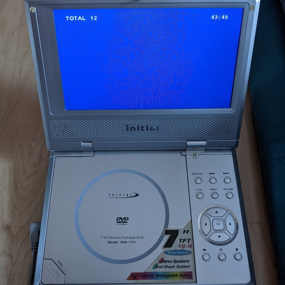 Portable DVD Player with charger and case.